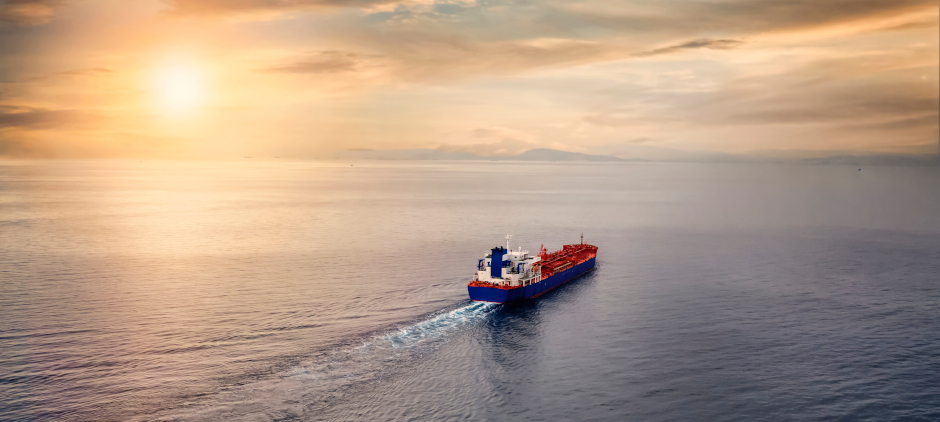 aerial,view,of,a,container,cargo,ship,sailing,over,calm
